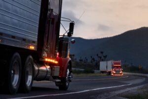 Two large trucks traveling on a road. A lawyer can explain how damages are calculated in a truck accident.