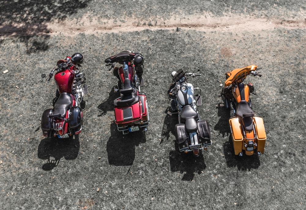 A group of motorcycles parked together to symbolize the question of whether lane splitting is legal in Connecticut.